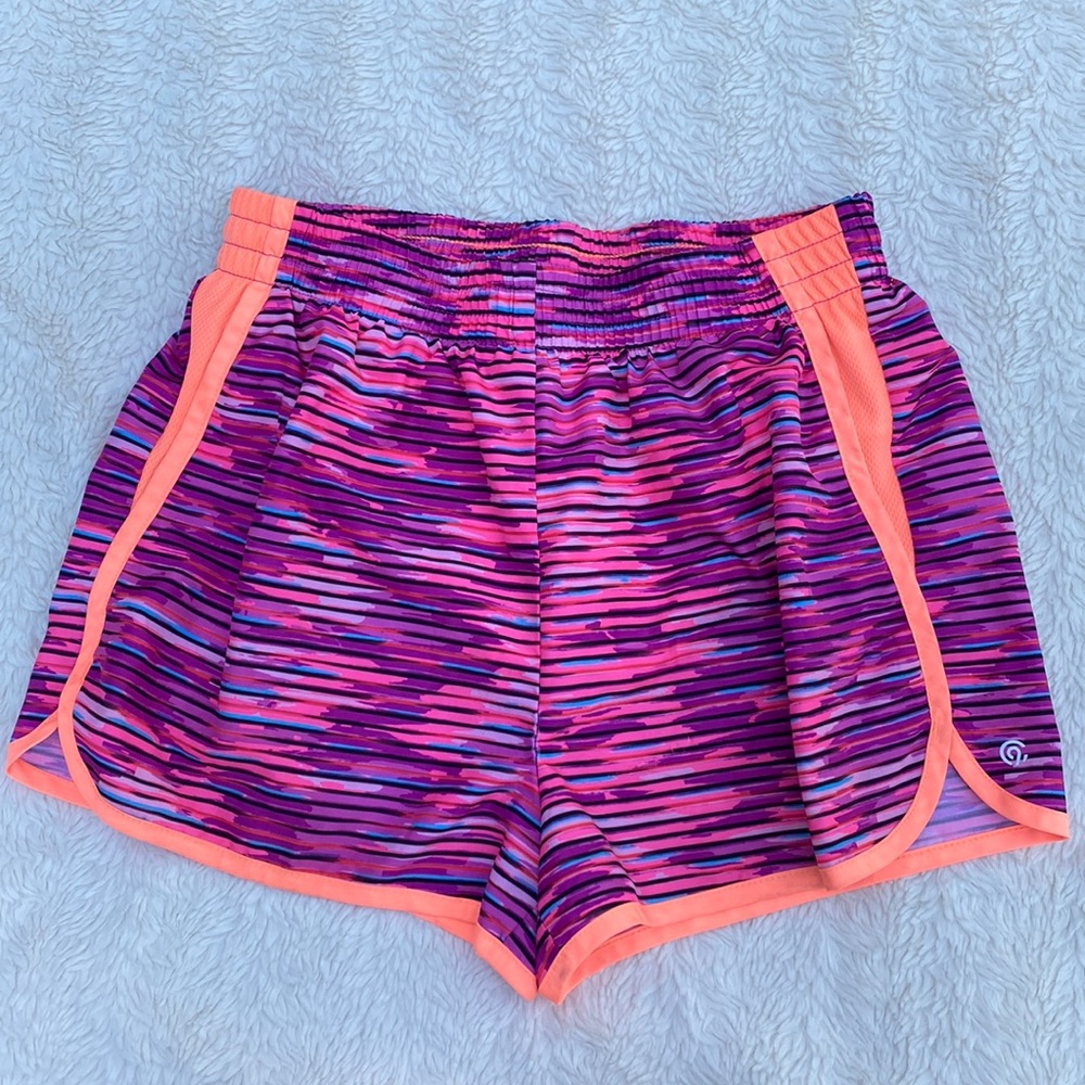 C9 Girls athletic shorts in vibrant orange and purple combination. L/10-12
